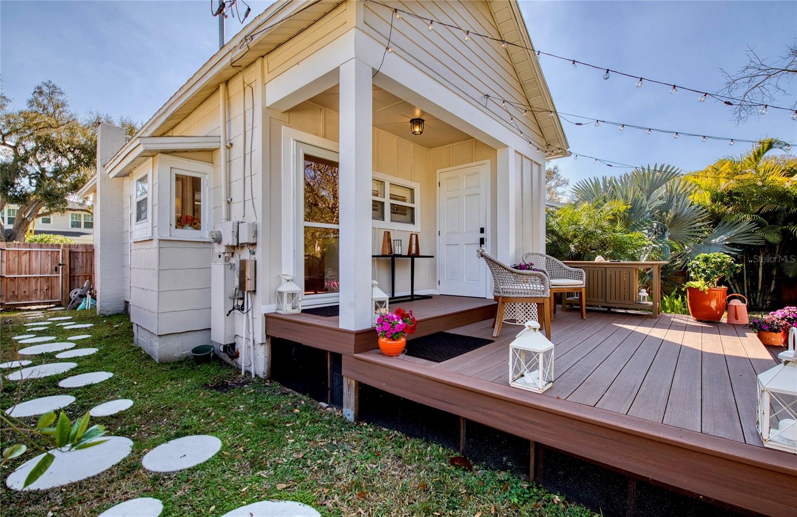 Stepping stones lead to the gate of the fully fenced back yard.