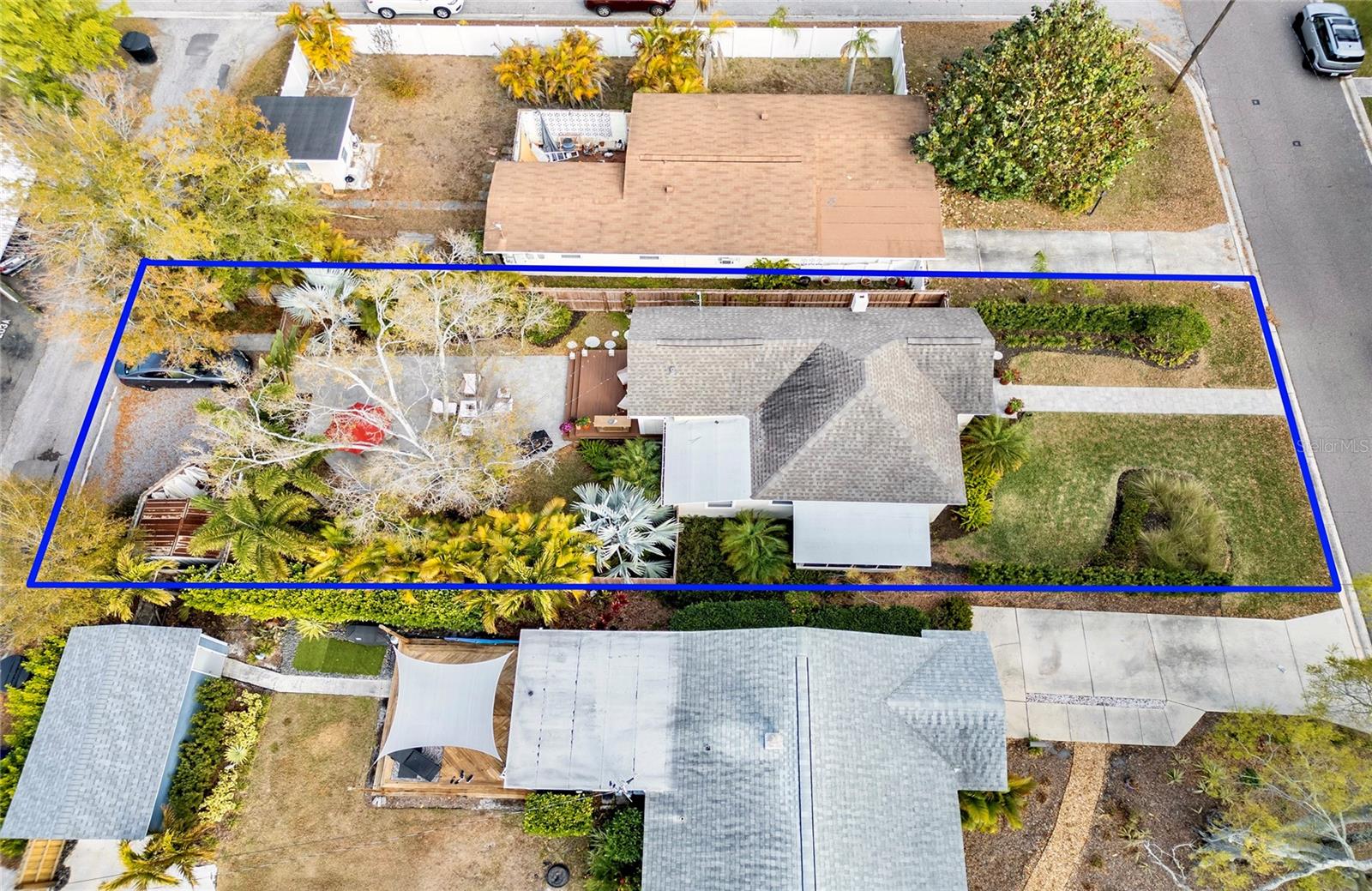 Lush, private backyard oasis for entertaining PLUS private parking pad & storage shed.