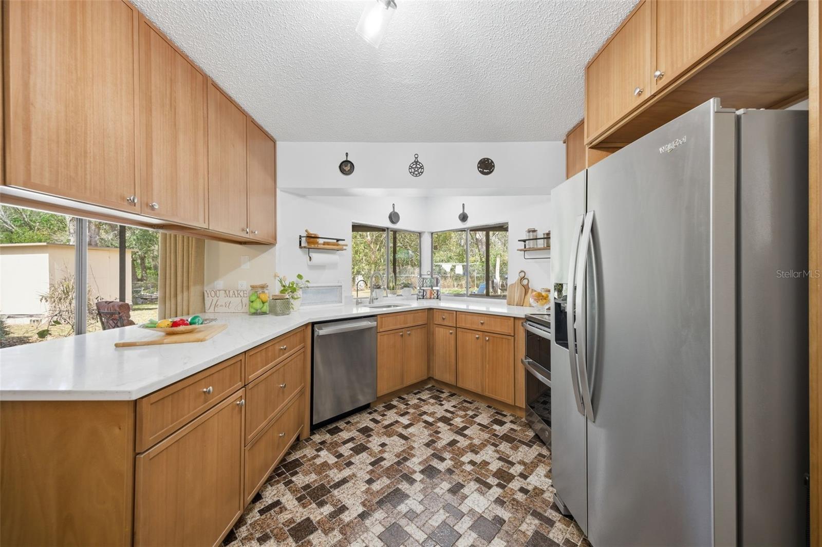 new kitchen with soft closing wood cabinets