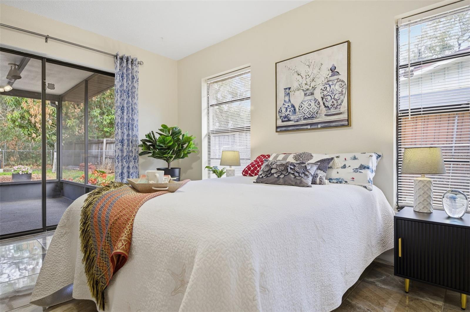 master bedroom with sliders to covered lanai
