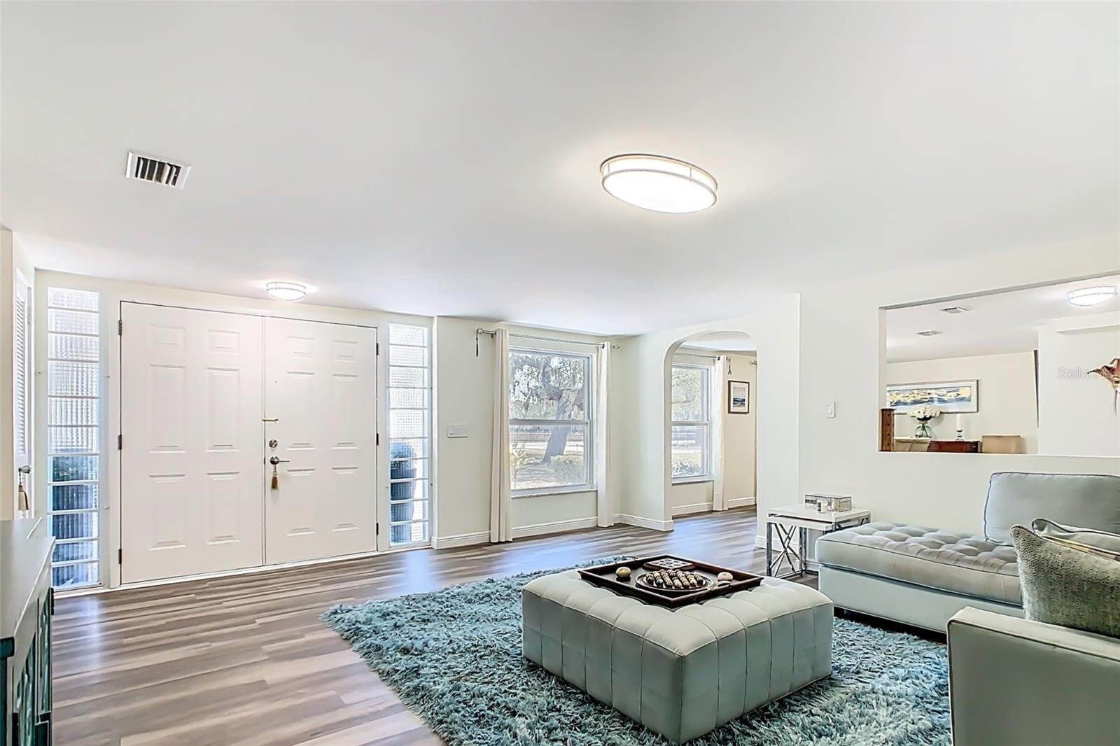 Renovated main living area featuring new flooring and open layout