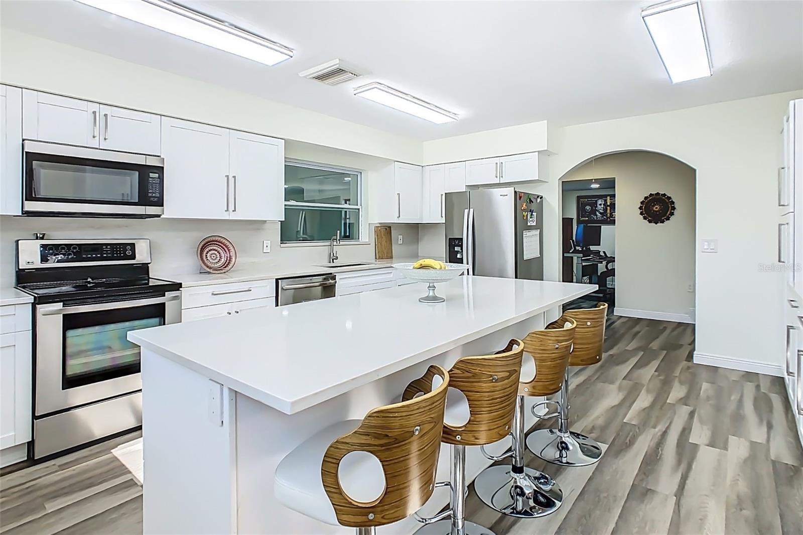 Spacious island with seating, ideal for gathering and entertaining