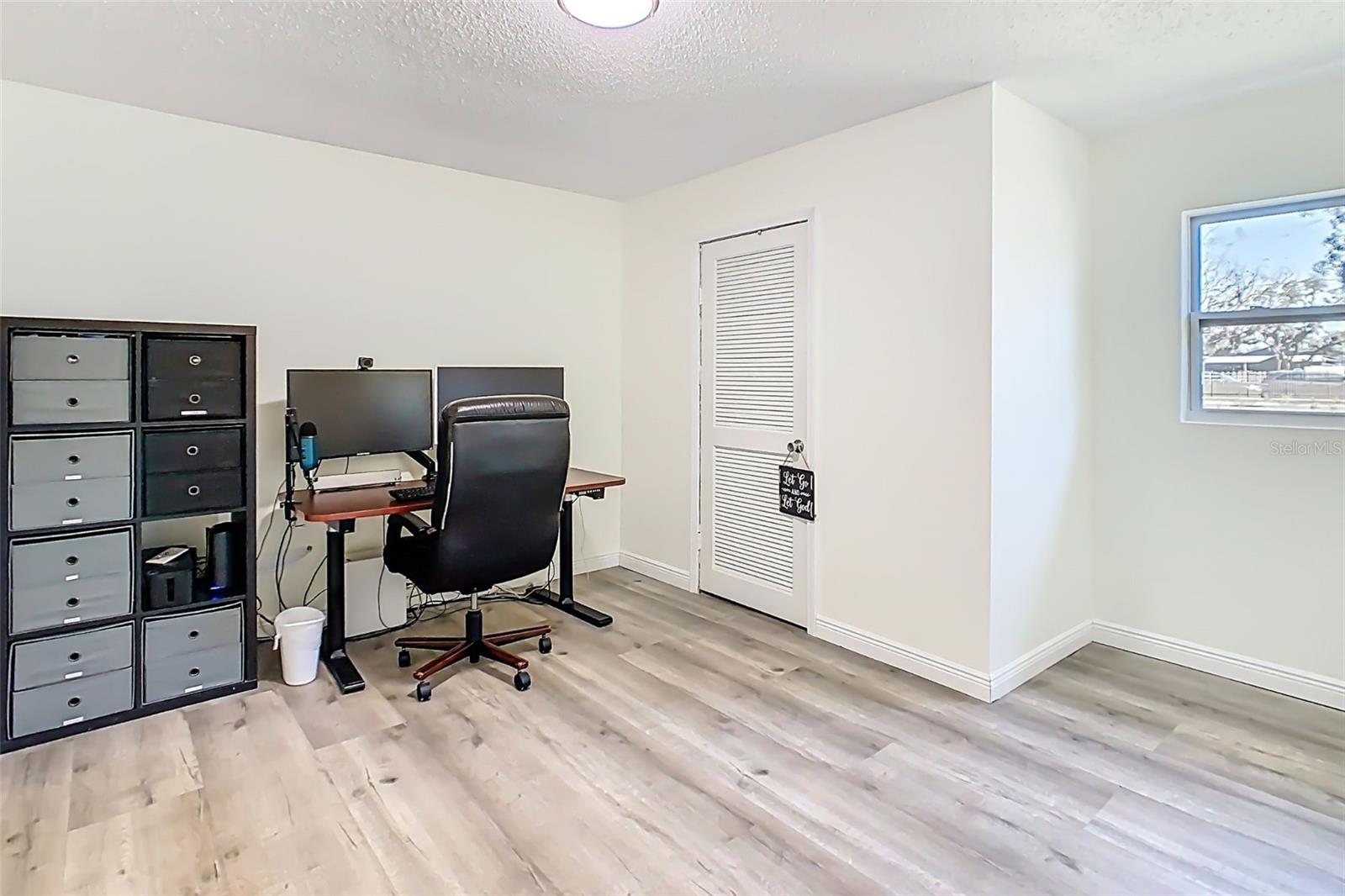 Bedroom 4 with natural light and closet storage.