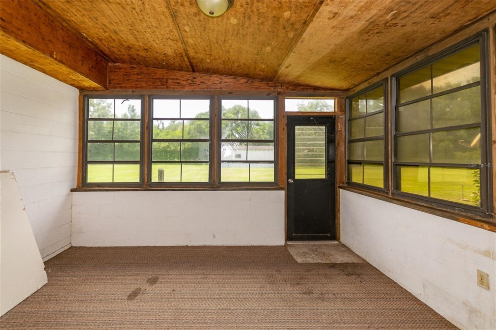 Florida room with surrounding windows