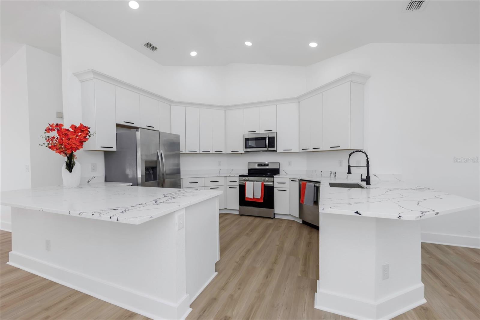 Expansive kitchen Island with high end quartz countertops