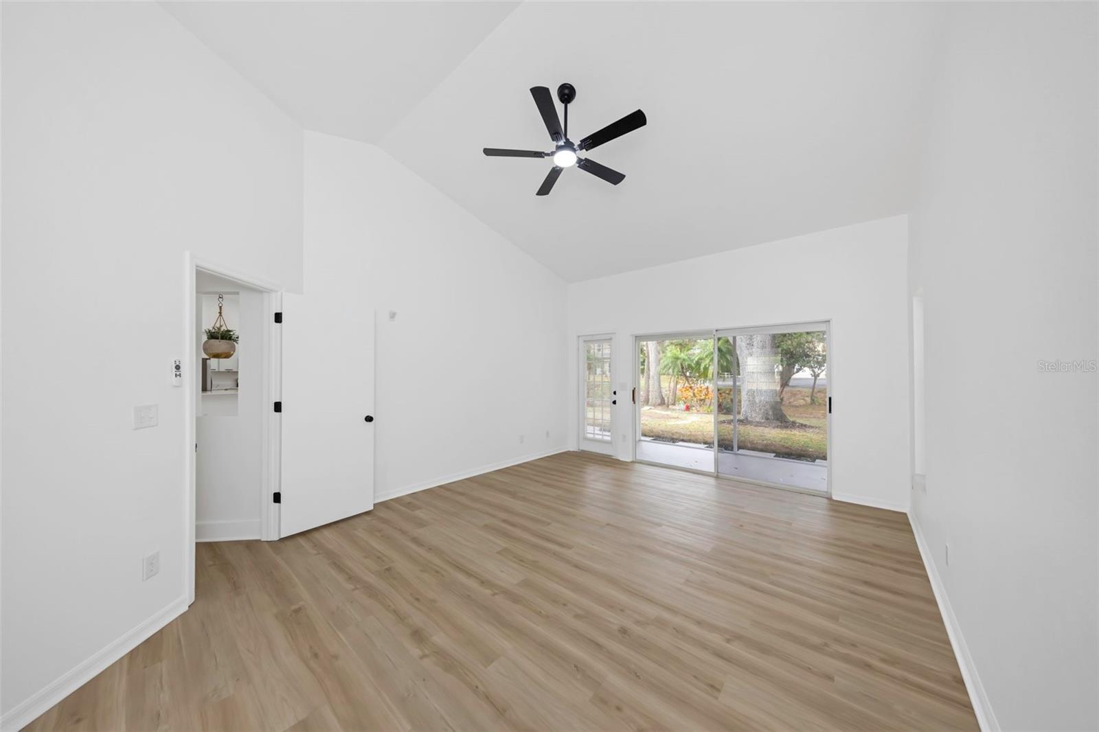 Master bedroom with sliders to screened in porch