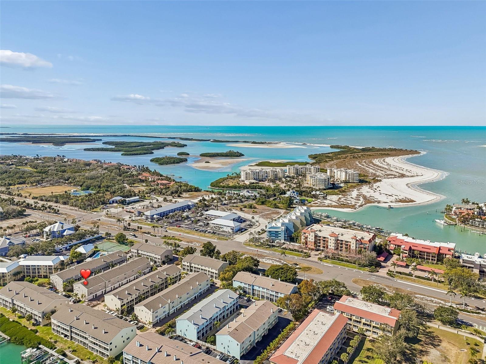 Aerial view highlighting the home’s prime location near Shell Key Preserve beaches, waterfront village shops, dining, and marinas, showcasing easy access to coastal recreation and local amenities.