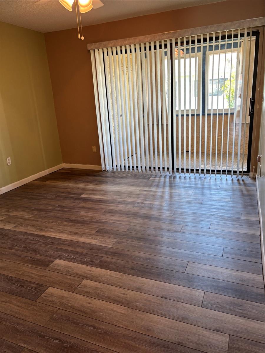 Primary bedroom overlooking florida room