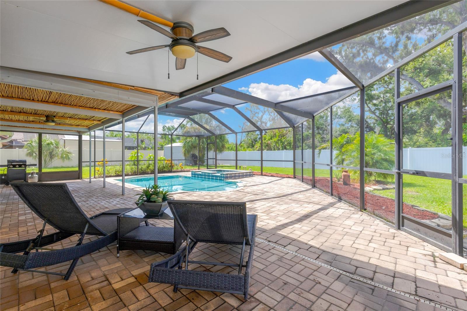 Covered lanai with a charming bamboo ceiling!