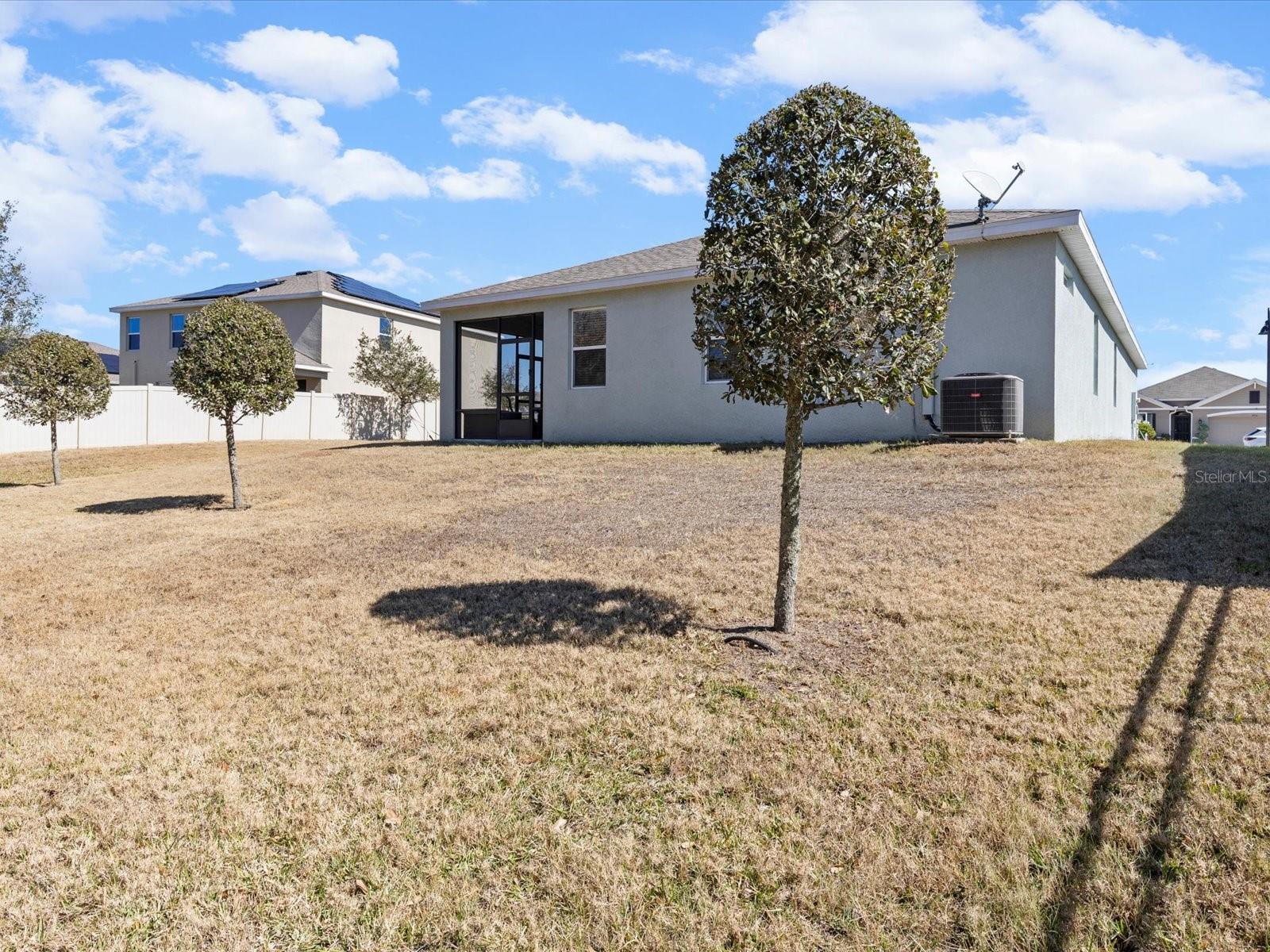Rear view of home from the backyard