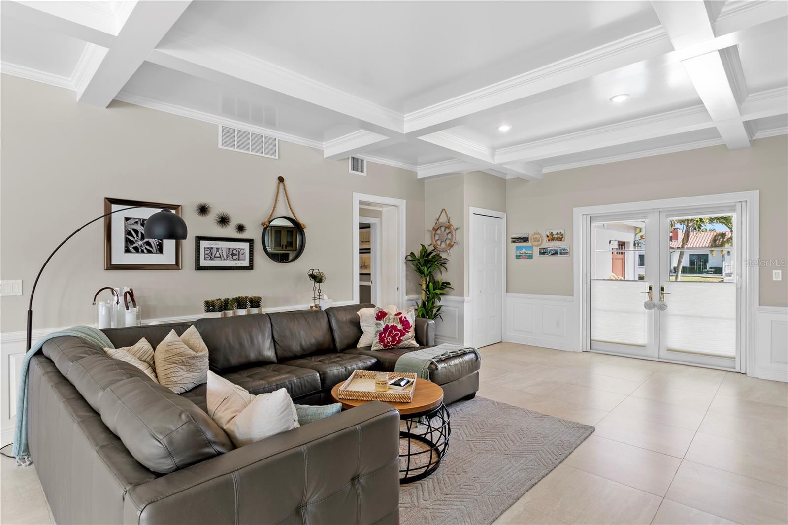Family room opens to the front garden and pool area