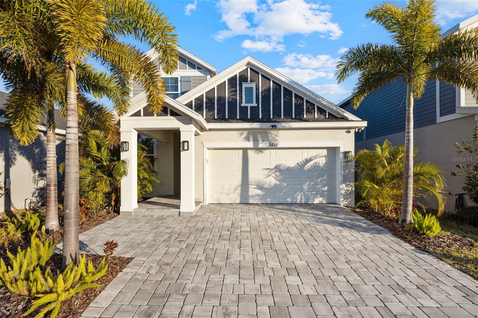Built in 2022 by David Weekley Homes with custom pavered driveway and welcoming entry in the highly sought-after Waterset community.