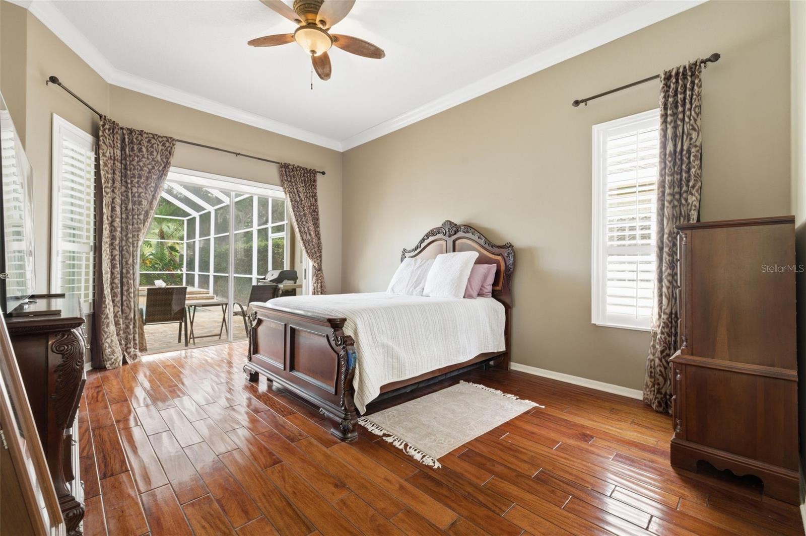 Primary suite with slider out to pool.