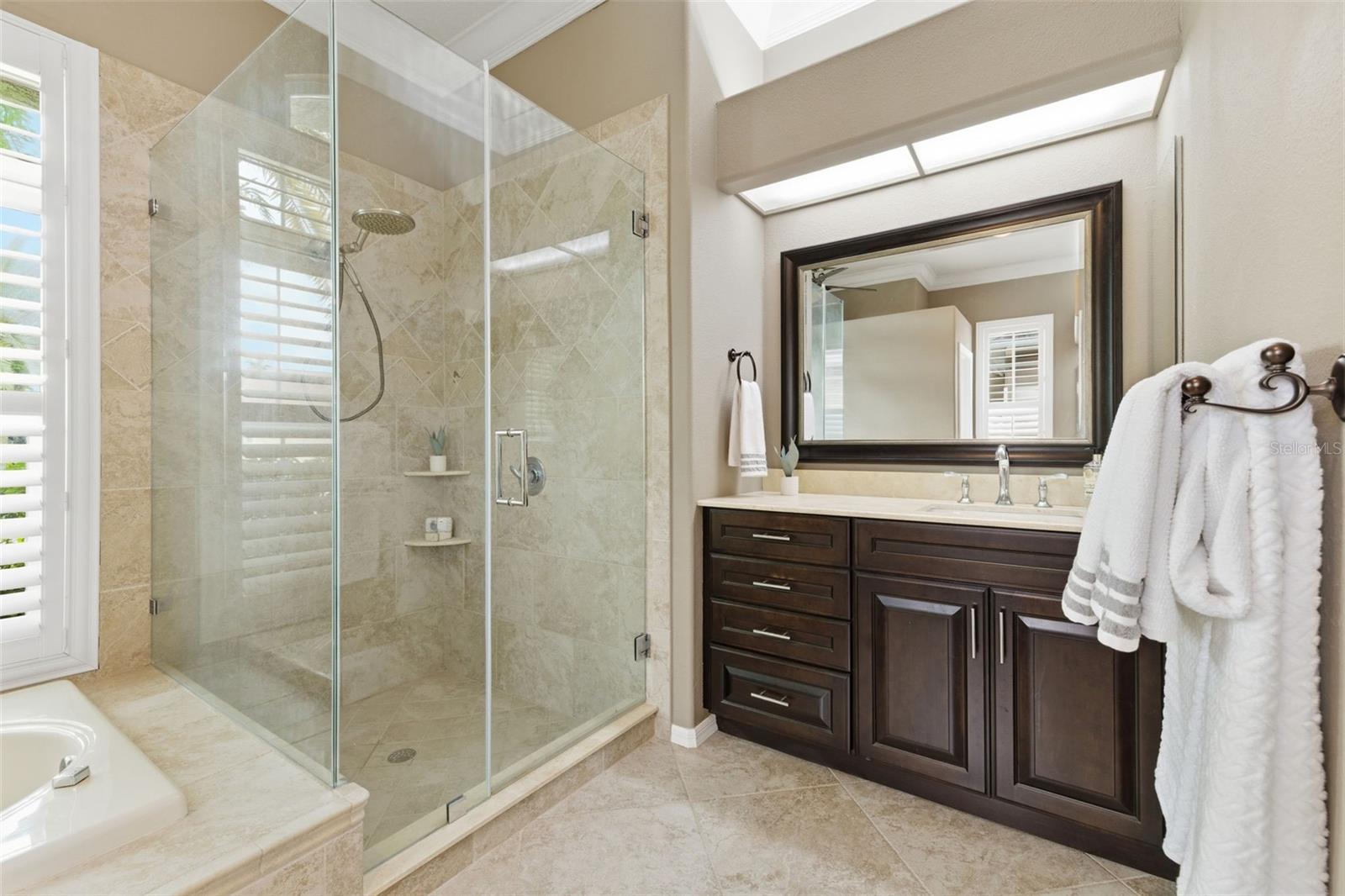 Remodeled primary suite with gorgeous walk in shower.