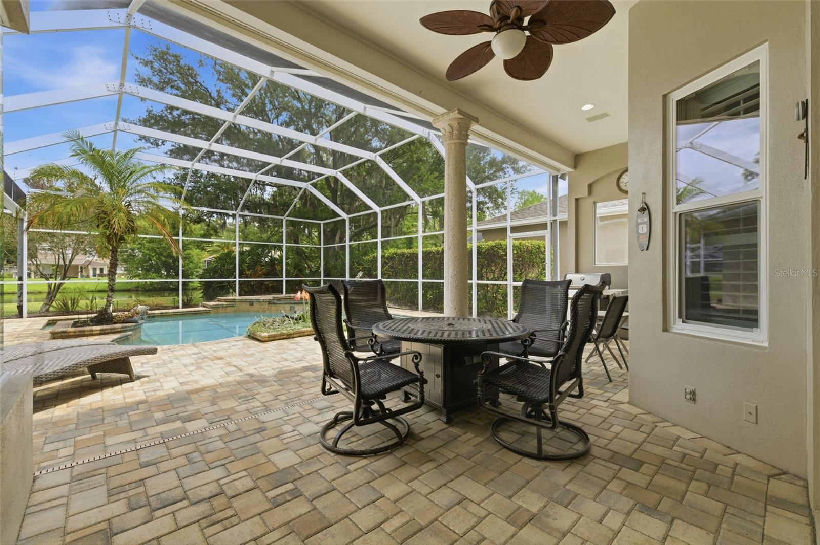 Covered dining area on pool deck.