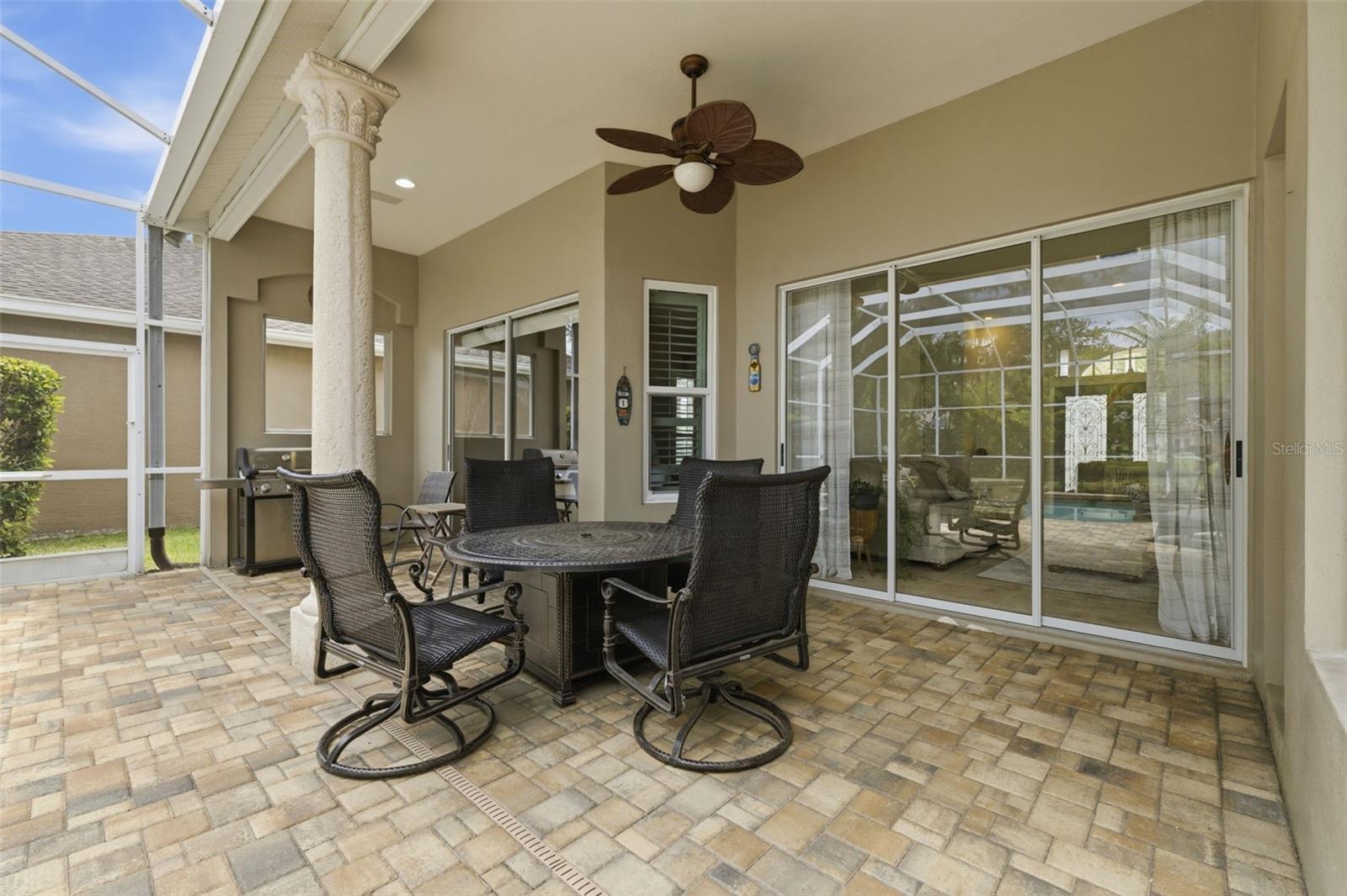 Covered dining area on pool deck.