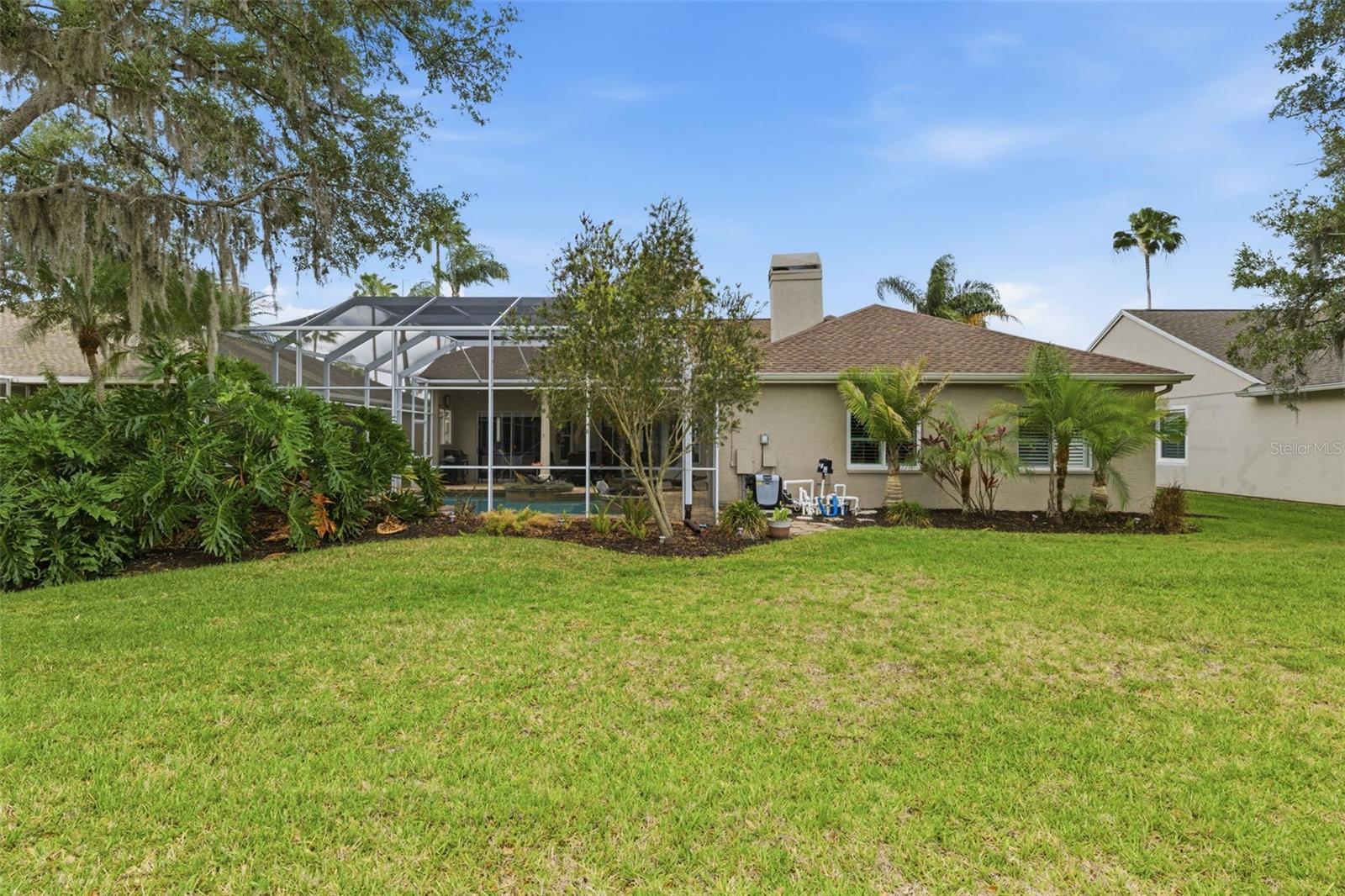 Large back yard to pond.