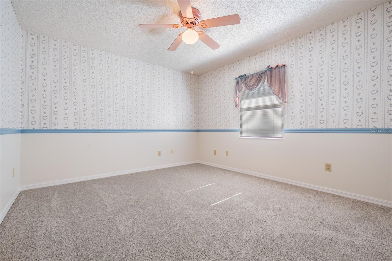 Secondary bedroom with chairrail