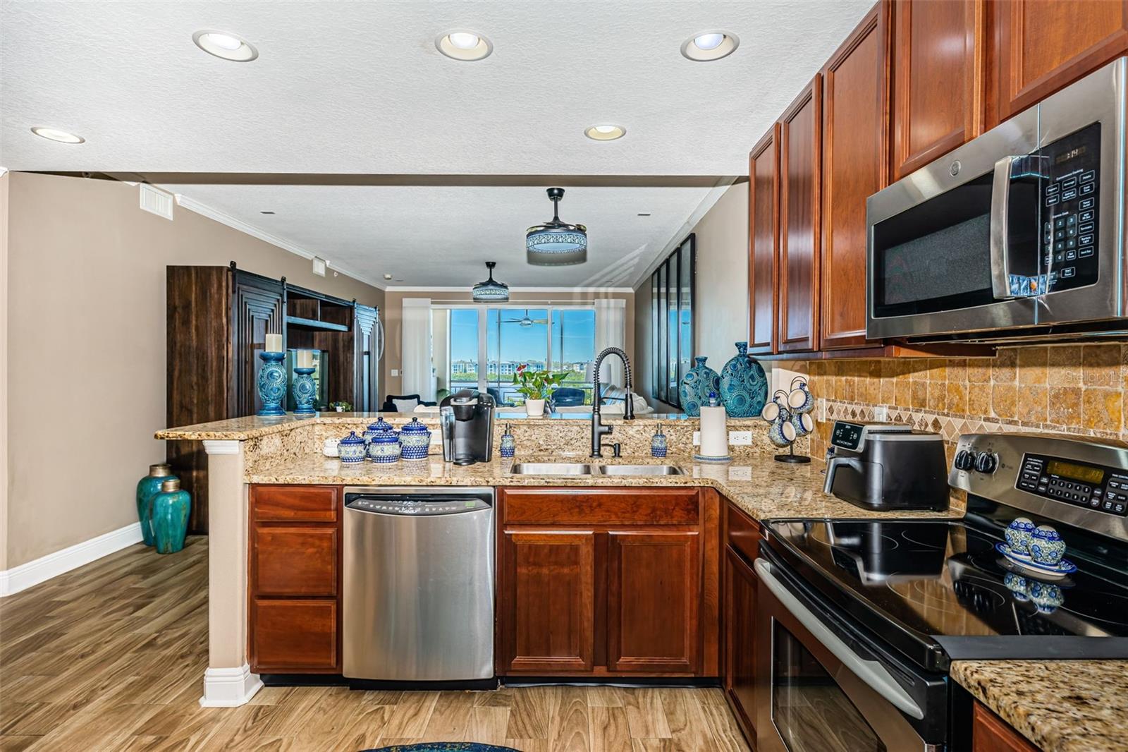 Kitchen view to balcony through living room