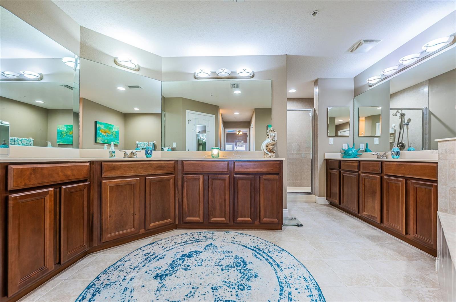Primary Bathroom loaded with space, lighting, mirrors separate double sinks