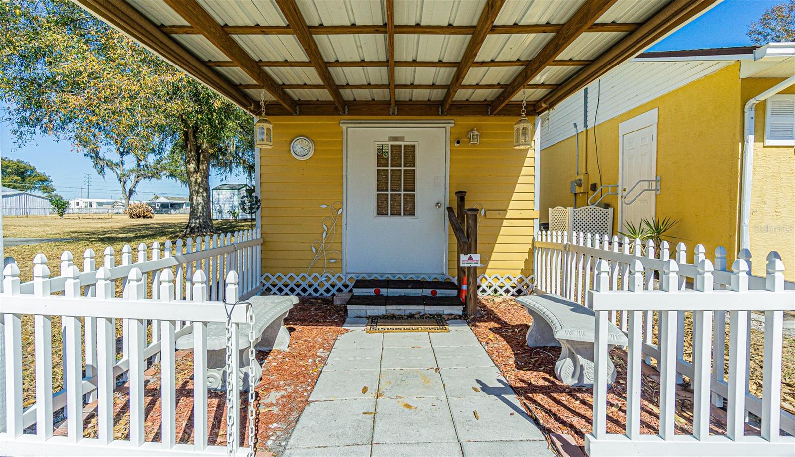 Covered entry to she shed...great for hobbies, fitness, storage or home office!