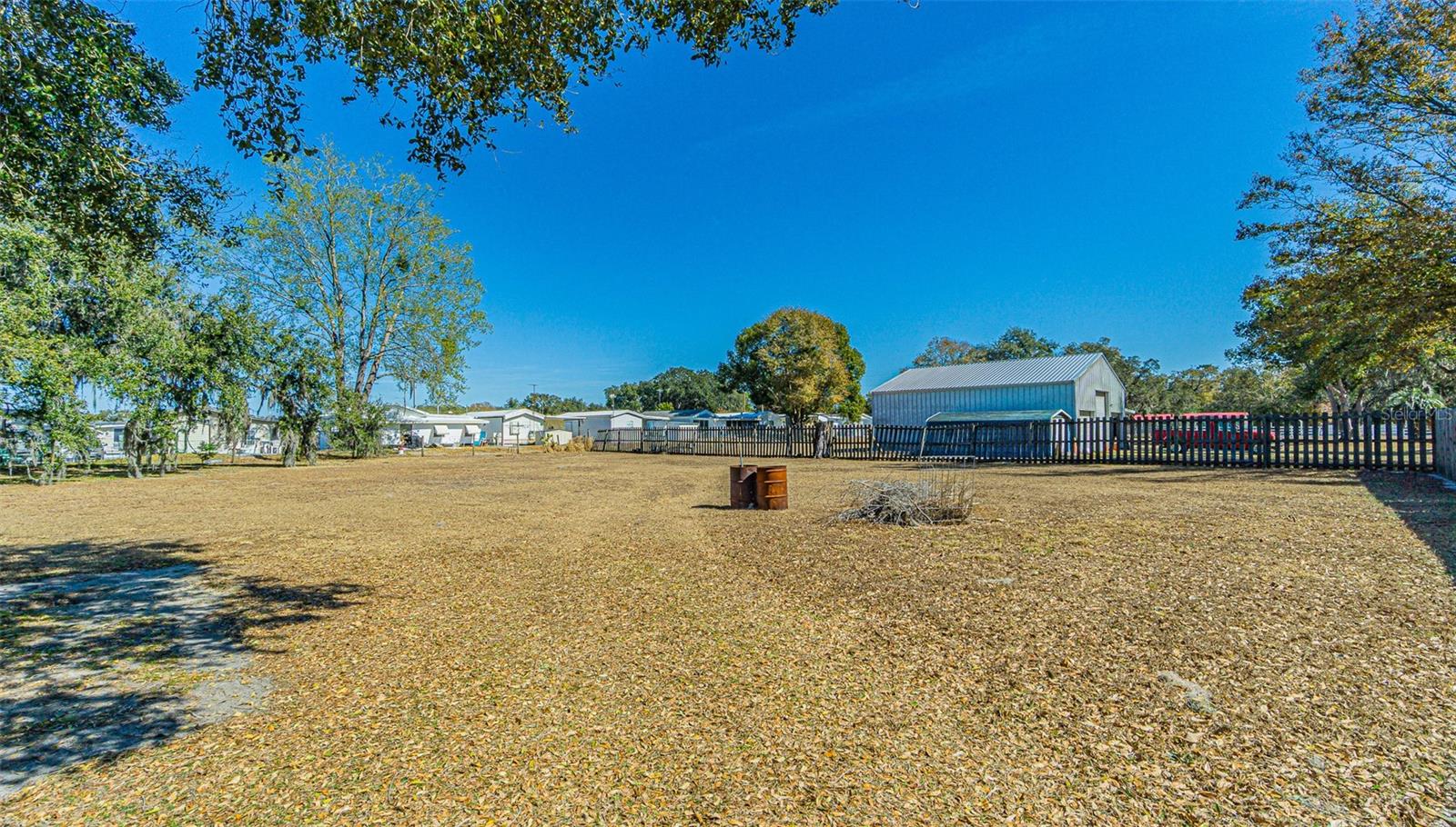 PROPERTY behind privacy fence included back to trees