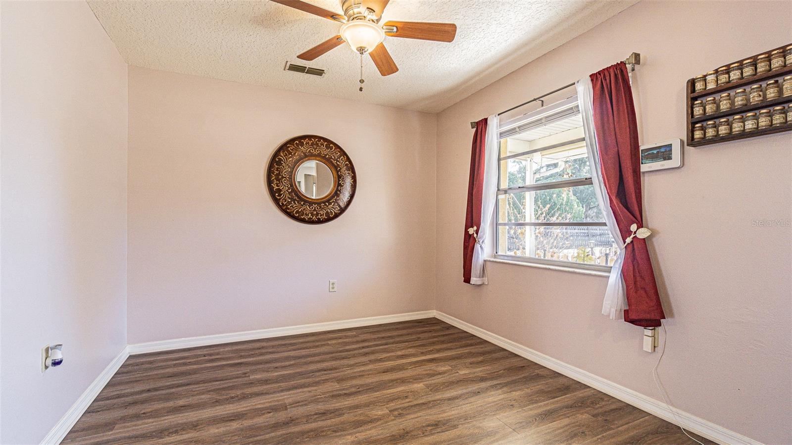 Dining room with a double window overlooking front porch