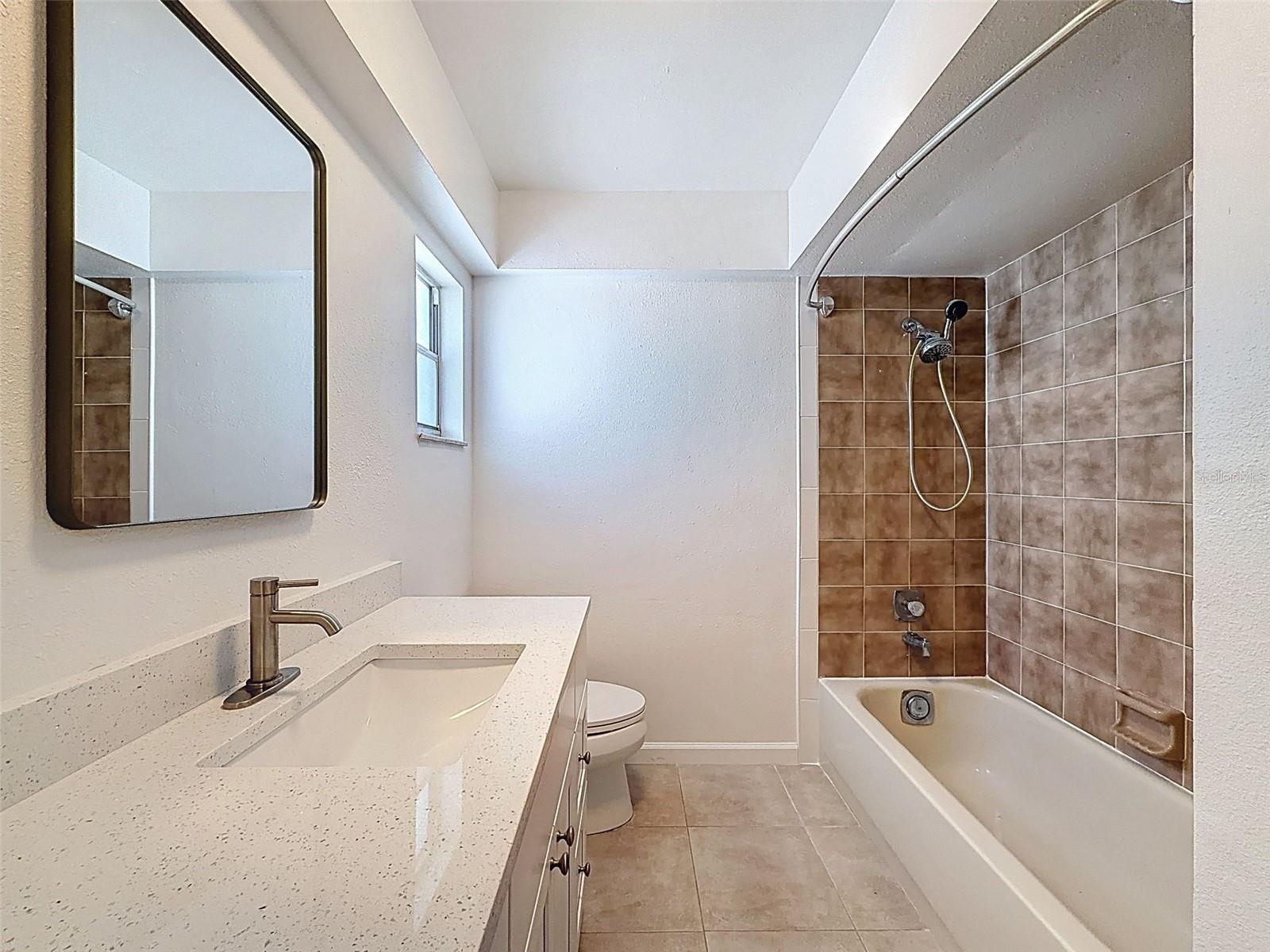 PLENTY OF VANITY TOP AREA.