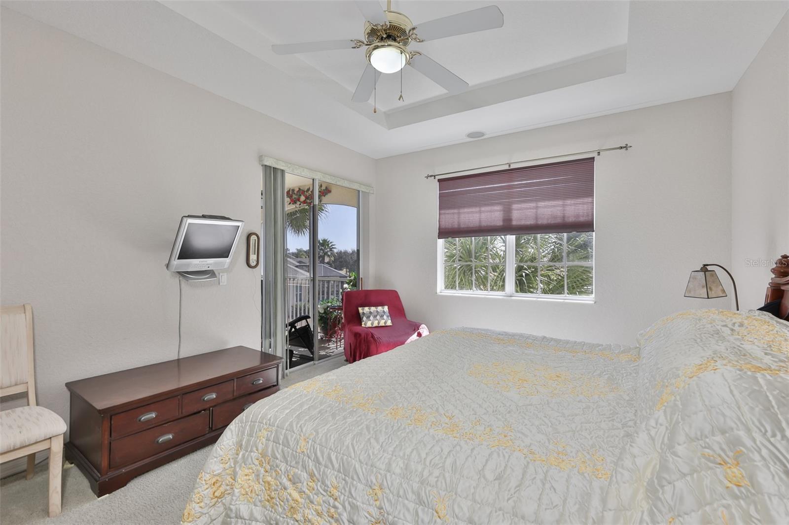 Sliding glass doors and large windows allow the sunshine to brighten the condo and allow sea breezes to filter through it.