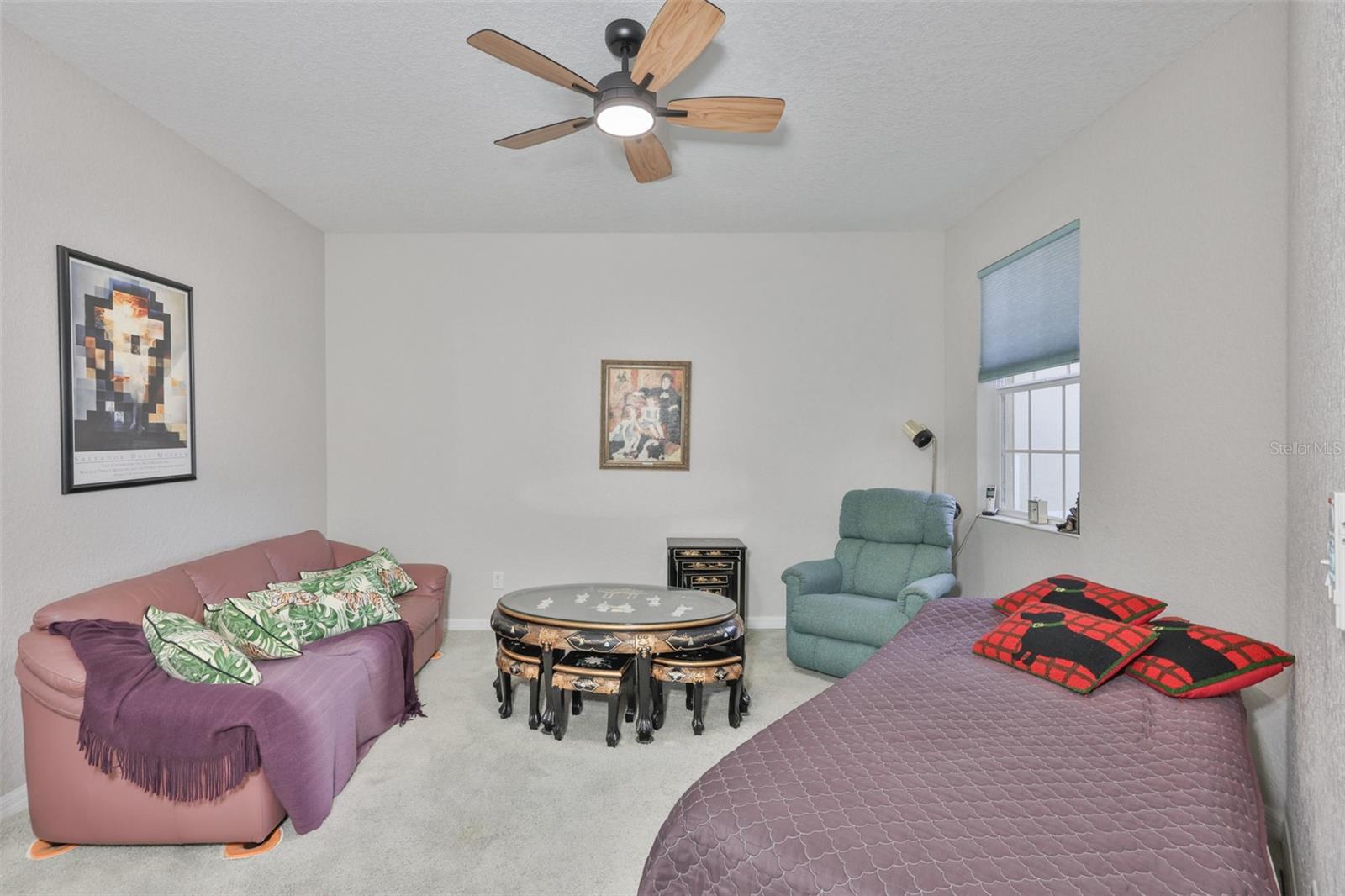 The den/office, just to the right at the top of the stairs is large with a view to the courtyard below.