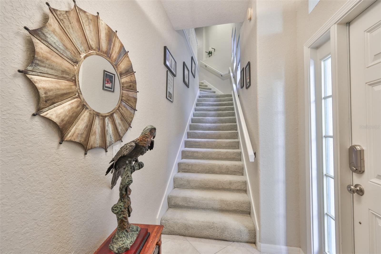 As you enter the unit, you can use the stairs or the private elevator, located right behind you.