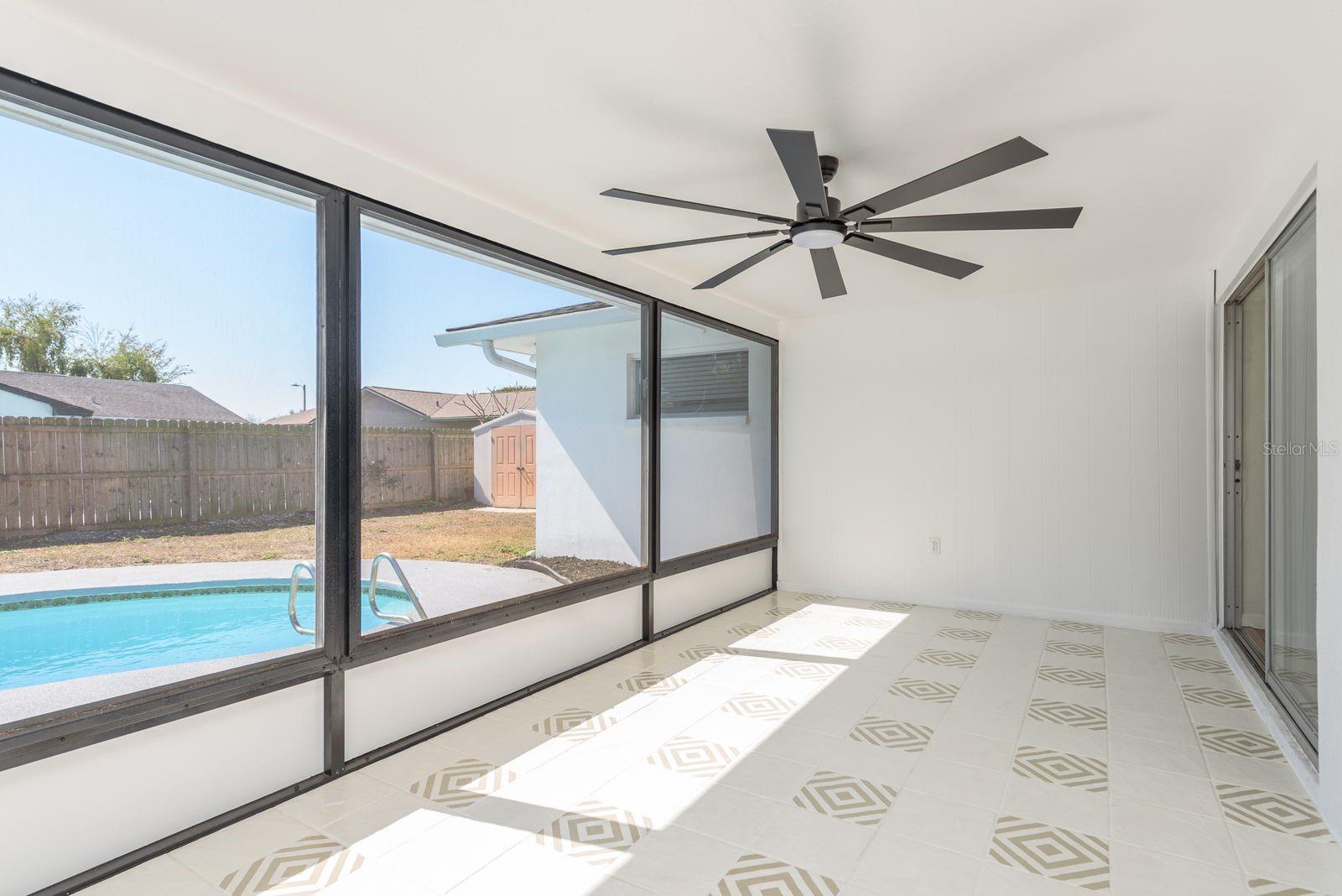 Oversized screen porch overlooking pool
