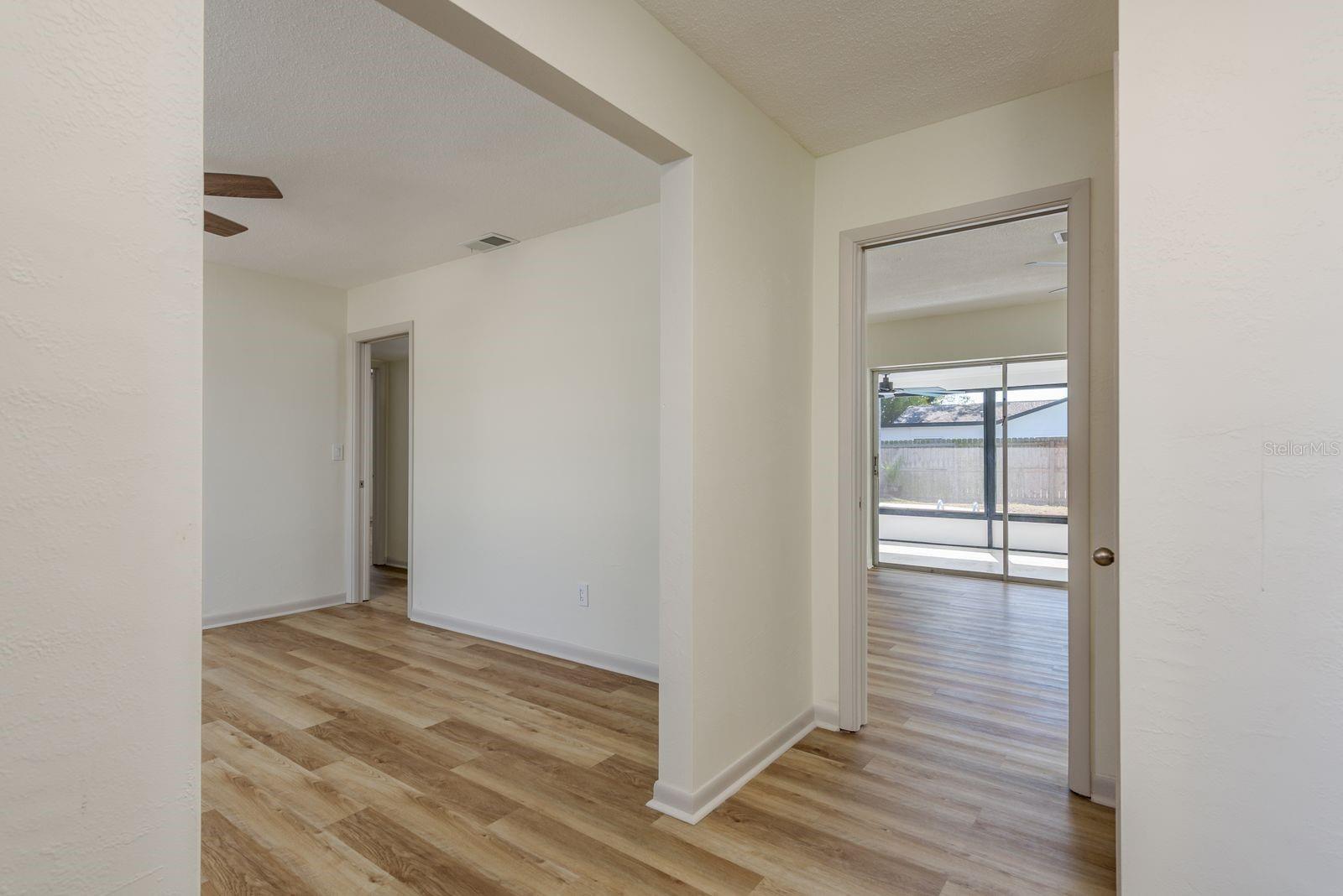 Living room looking out to kitchen and din room