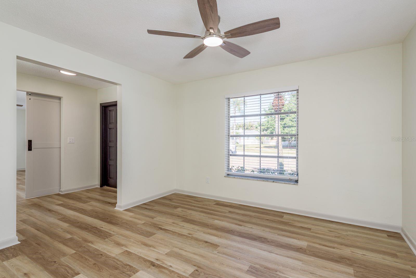 Dining room with ceiling fan and freshly painted