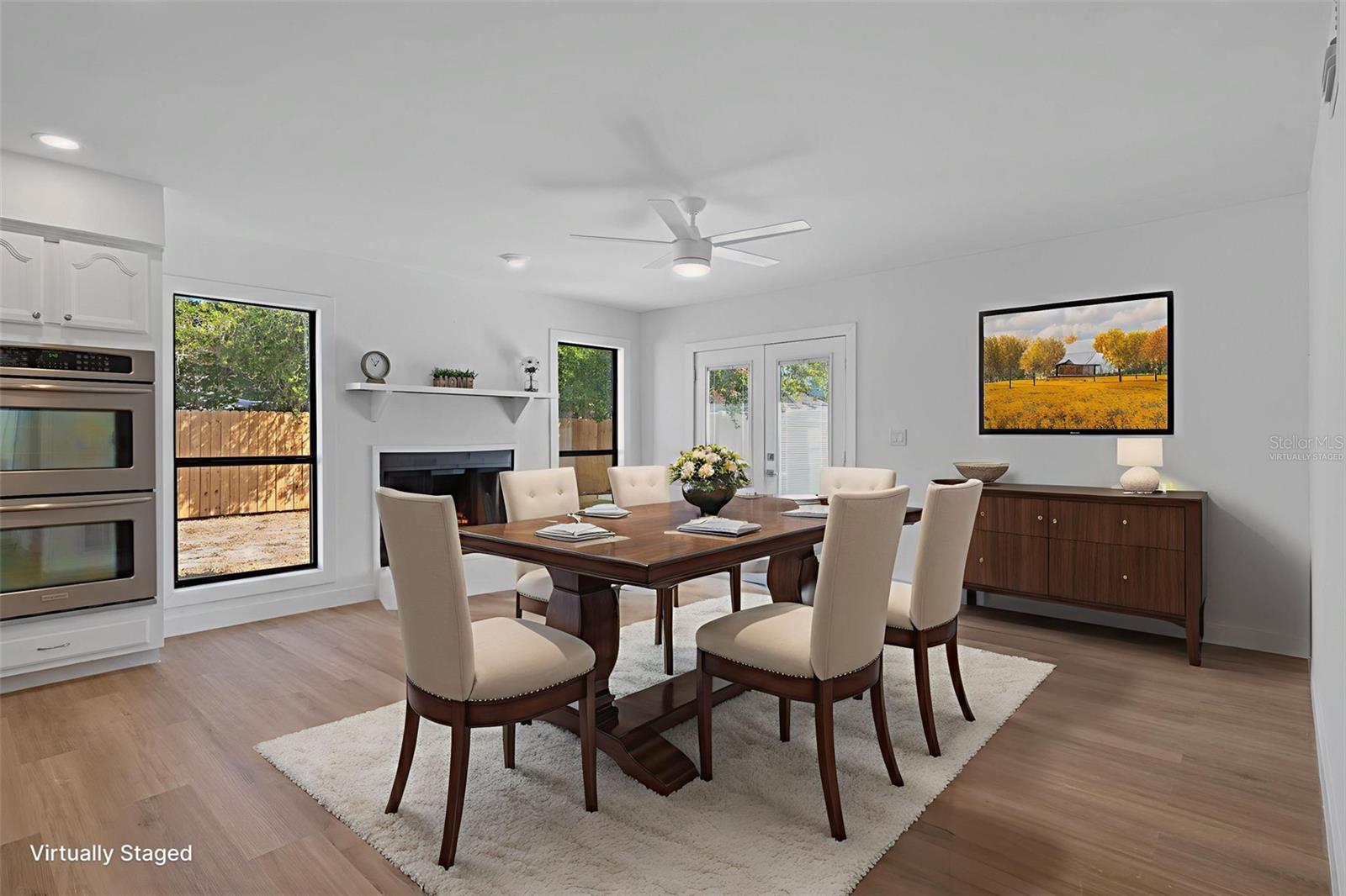 Living Room virtually staged as a formal dining room