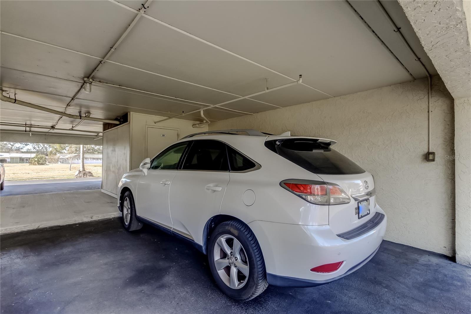 Under Building assigned parking spot along with storage closet