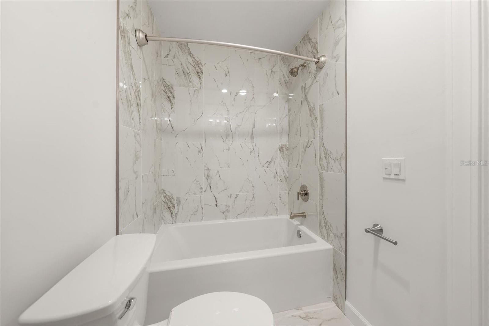 Primary bathroom with new tub and tile