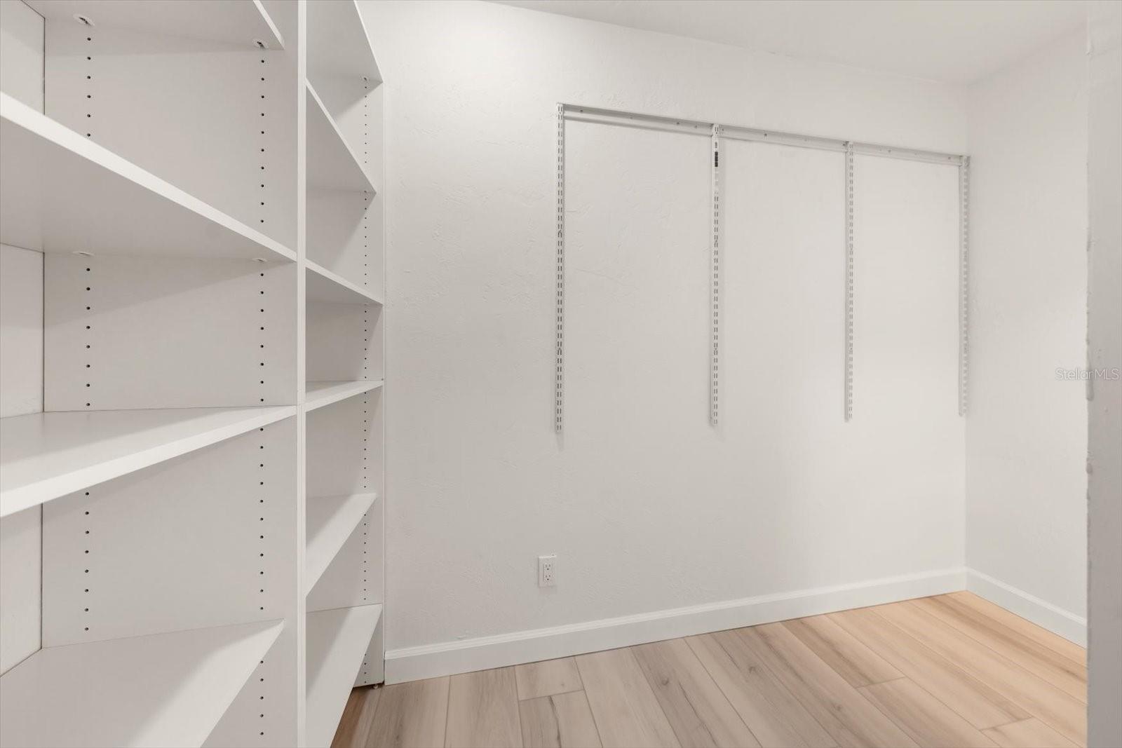 Extra large walk-in closet in primary bedroom, design your perfect closet system!