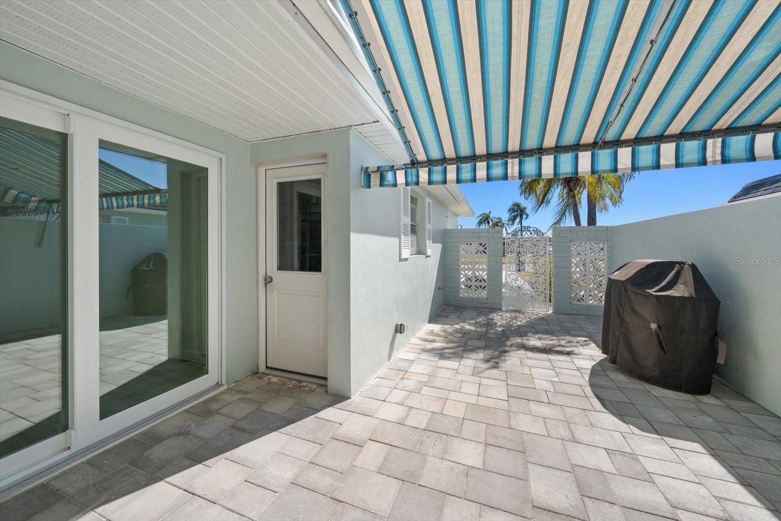 Front patio - sliders to 2nd bedroom and access to garage