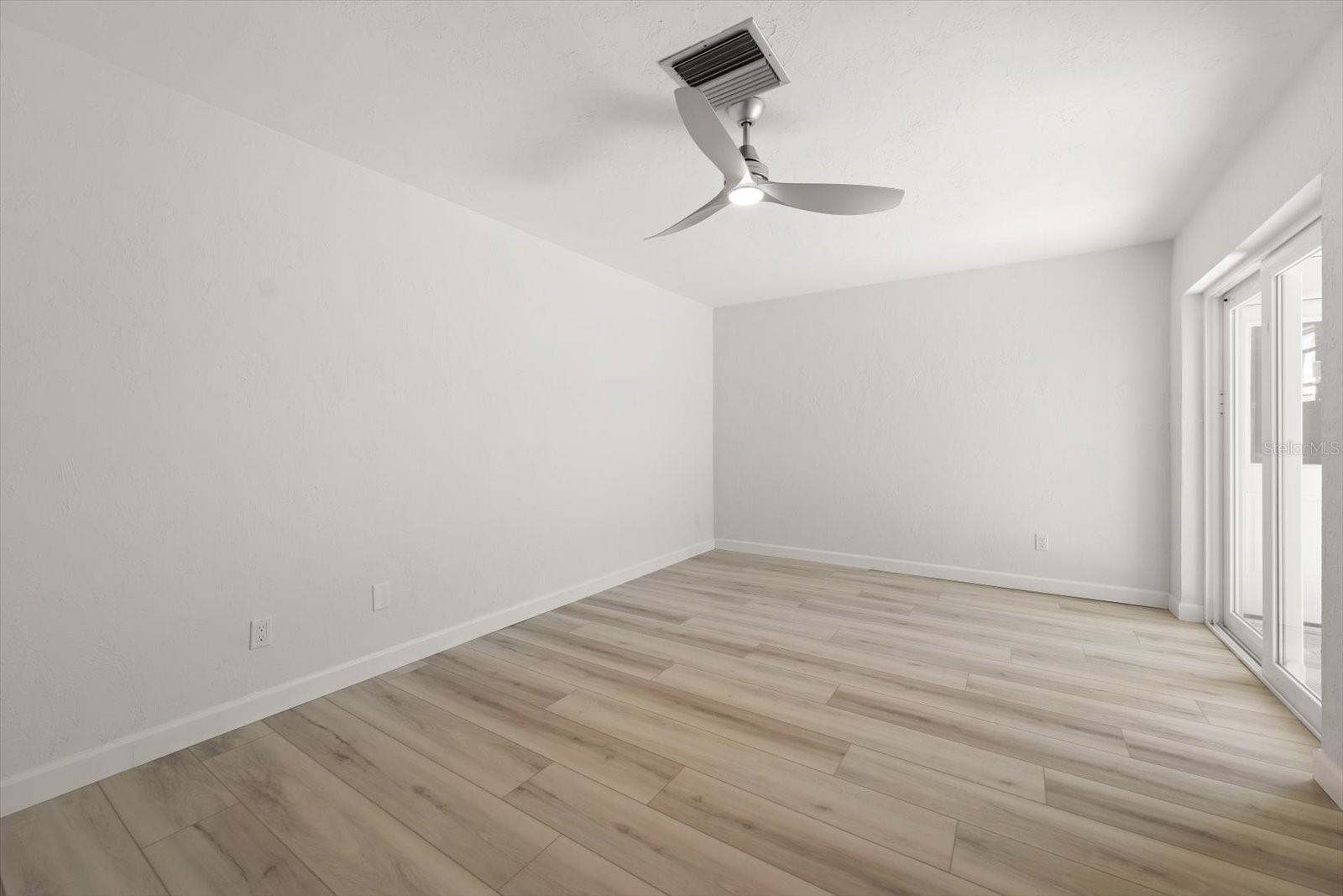 large 2nd bedroom, nice and bright with sliders to front patio