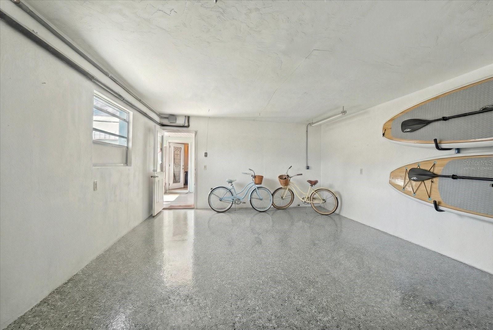 1 car garage - virtually staged floor, laundry room in the garage