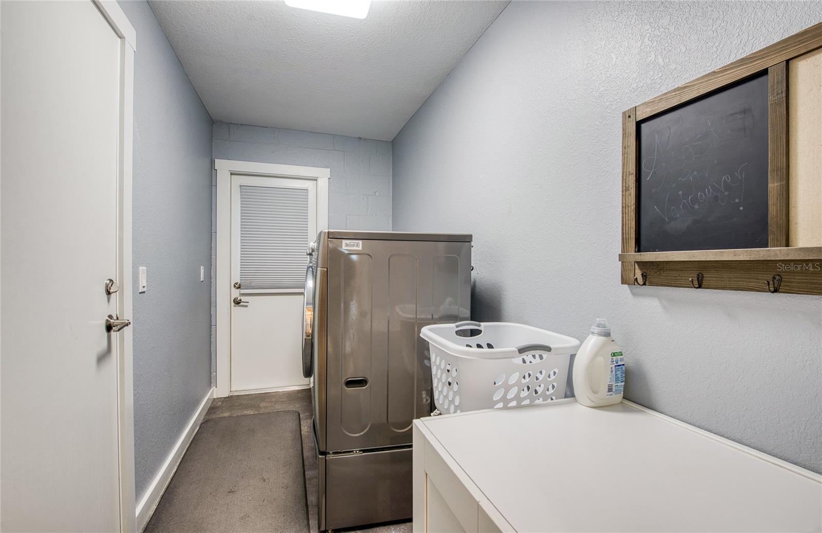 Inside Utility with Doorways to Garage and Outside