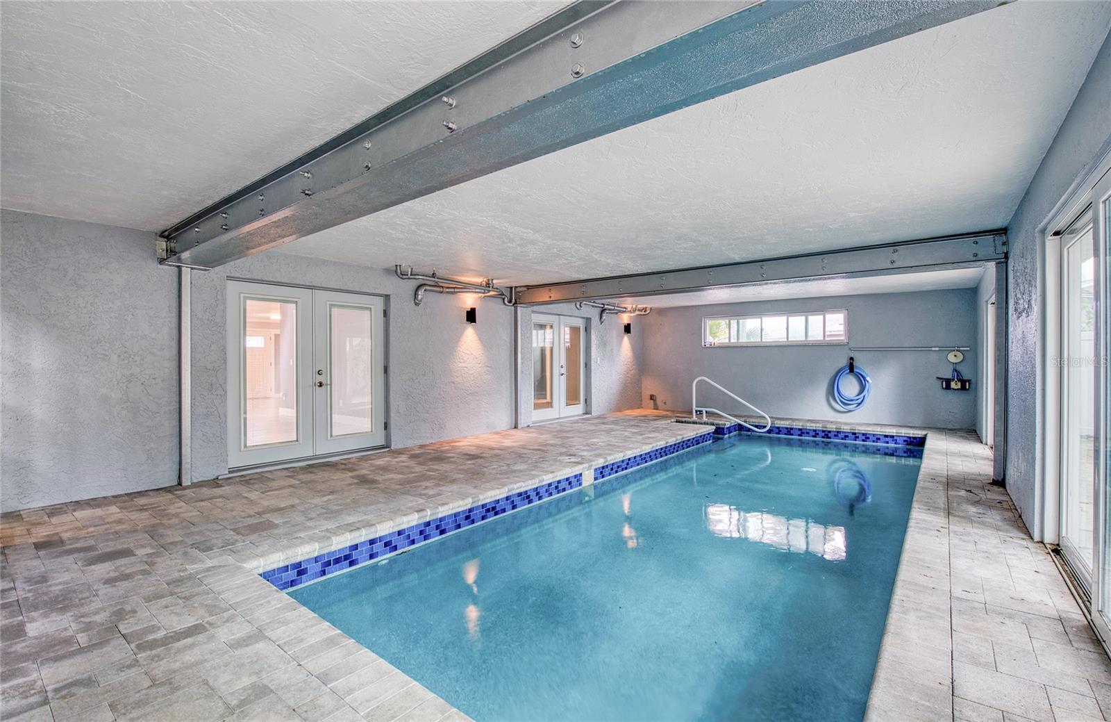 Indoor Pool Area with French Doors to Living Area closed