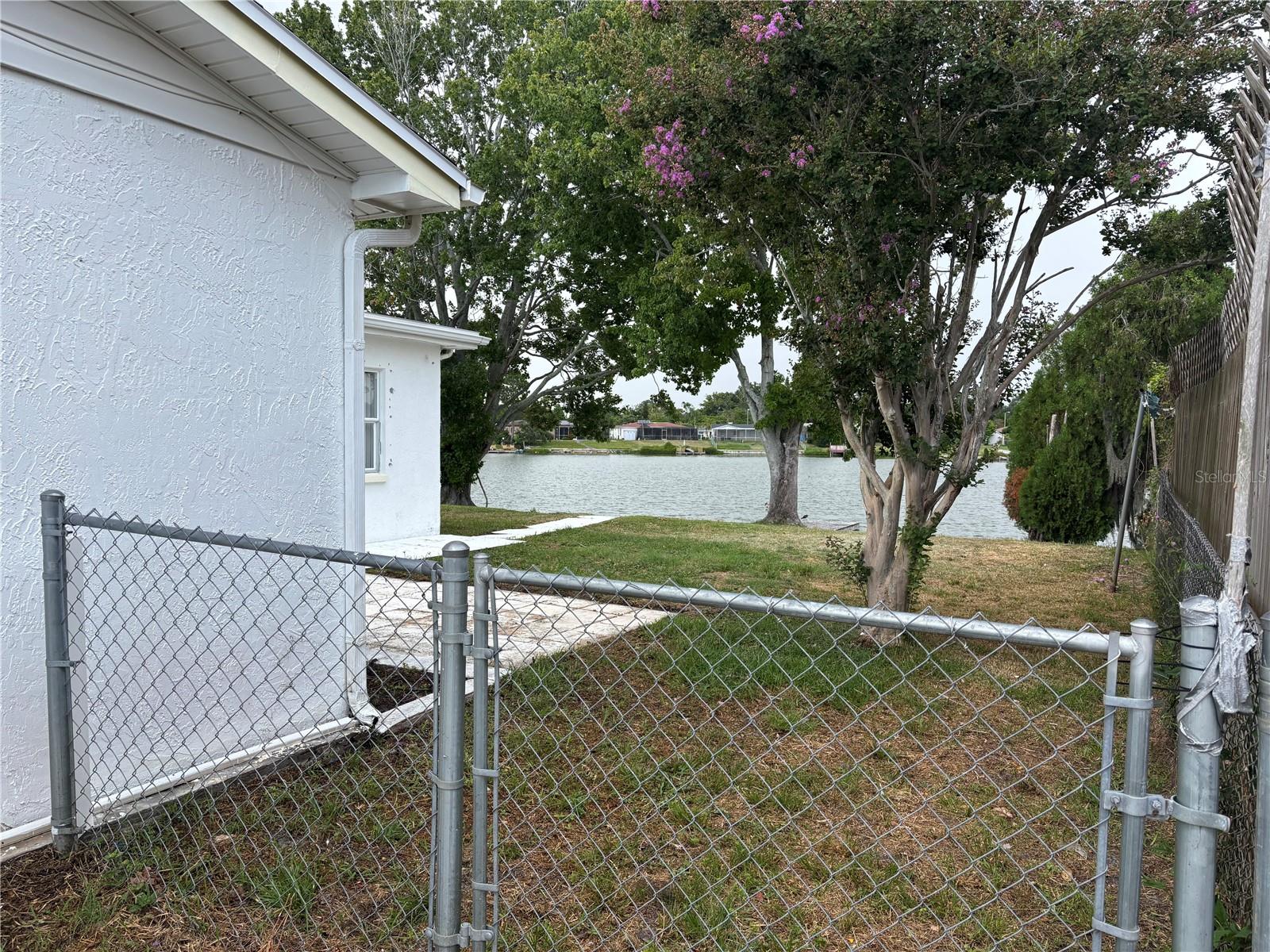 Fully Fenced Backyard With 79 Feet Of Lake Front!