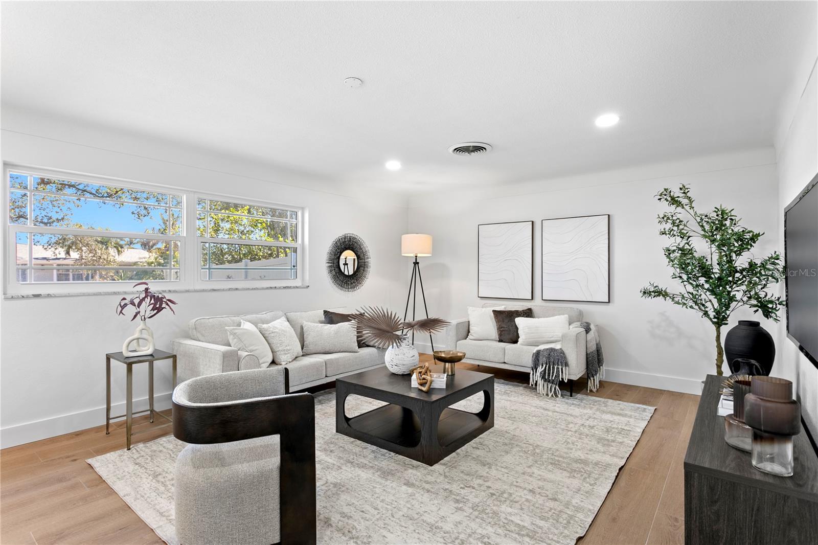 Bedroom staged as extra living