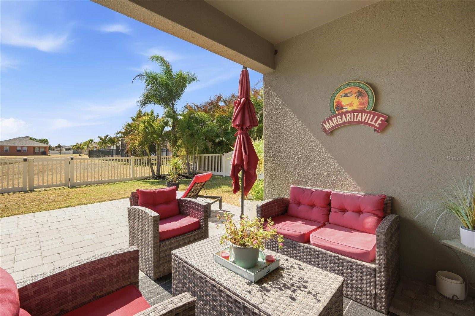 Extended 22' x 13' paver lanai with fenced backyard