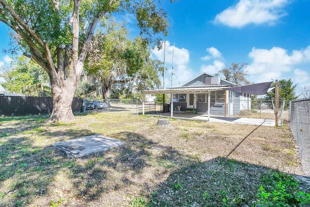 Backyard with carport and outdoor seating