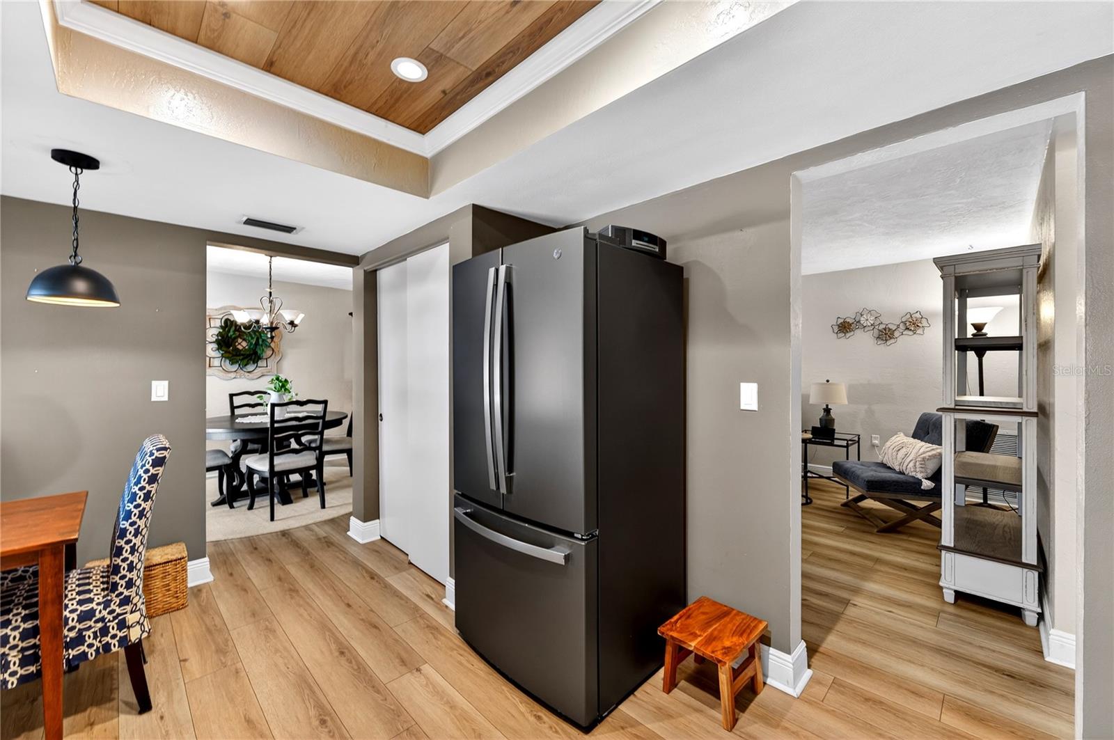 Walkway into the living room providing two entrances into the kitchen.