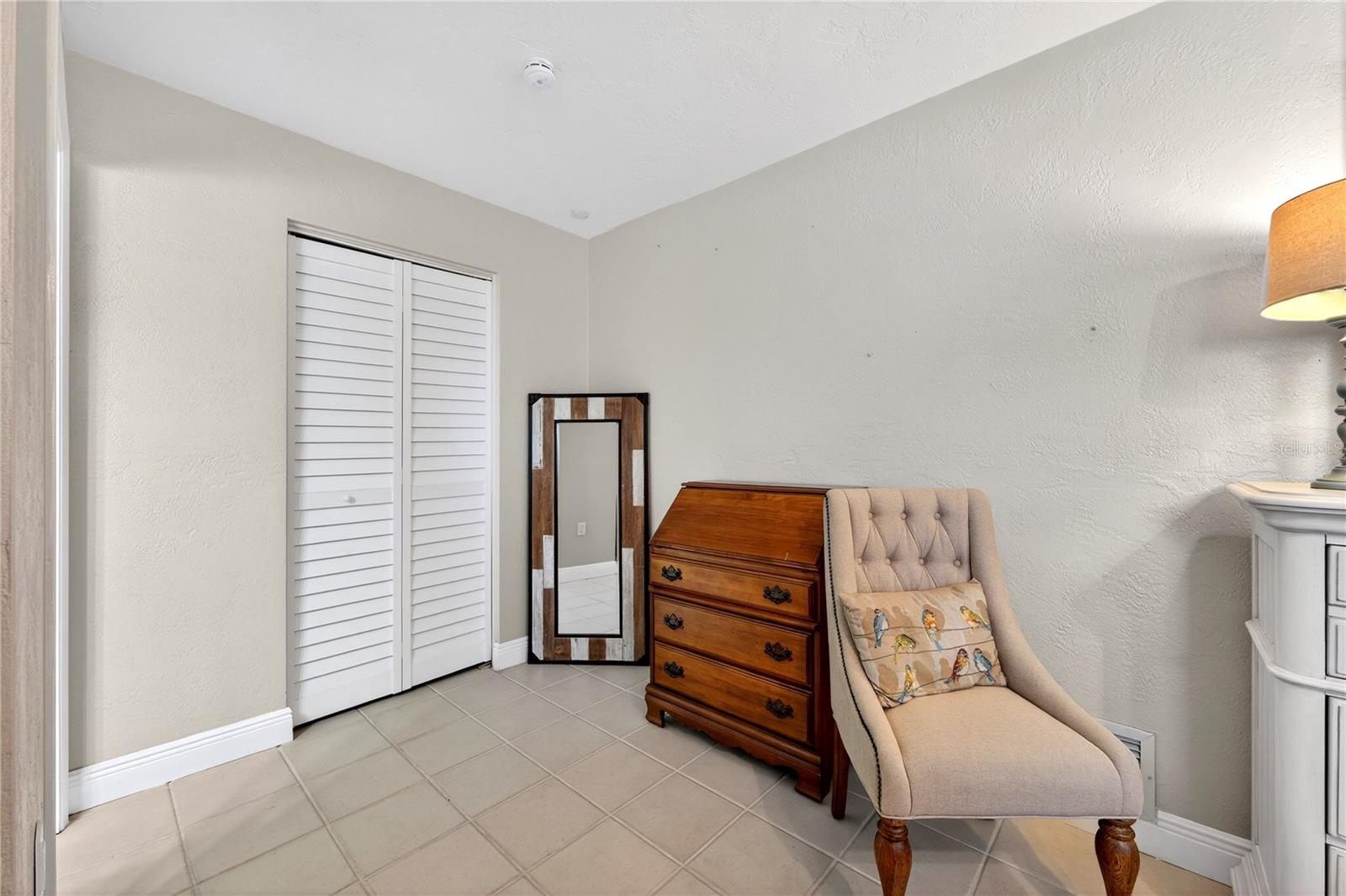 Sitting area in Primary Bedroom and large walk-in closet entrance