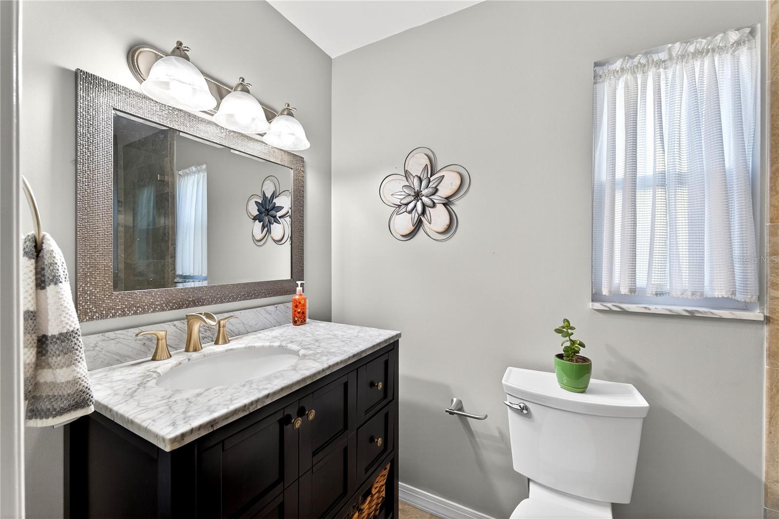 Fully renovated Primary Bathroom with extra counter space vanity